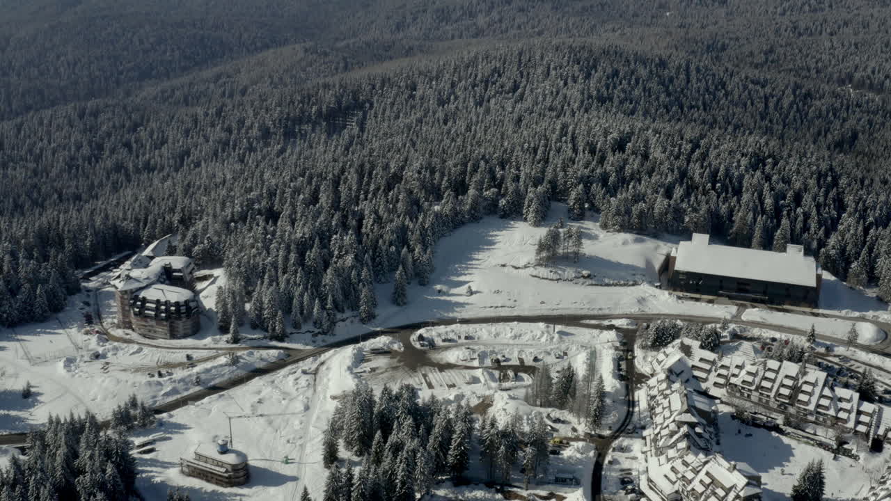 Aerial View of a Snow-Covered Ski Resort in a Winter Mountain Landscape