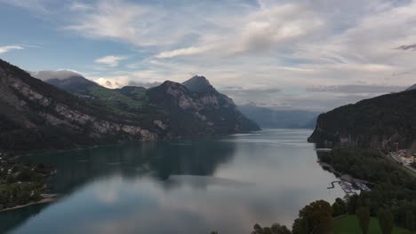 aerial view over walensee lake near wessen, glarus nord, switzerland, showcasing tranquil waters surrounded by majestic mountains and lush greenery in a peaceful, scenic landscape