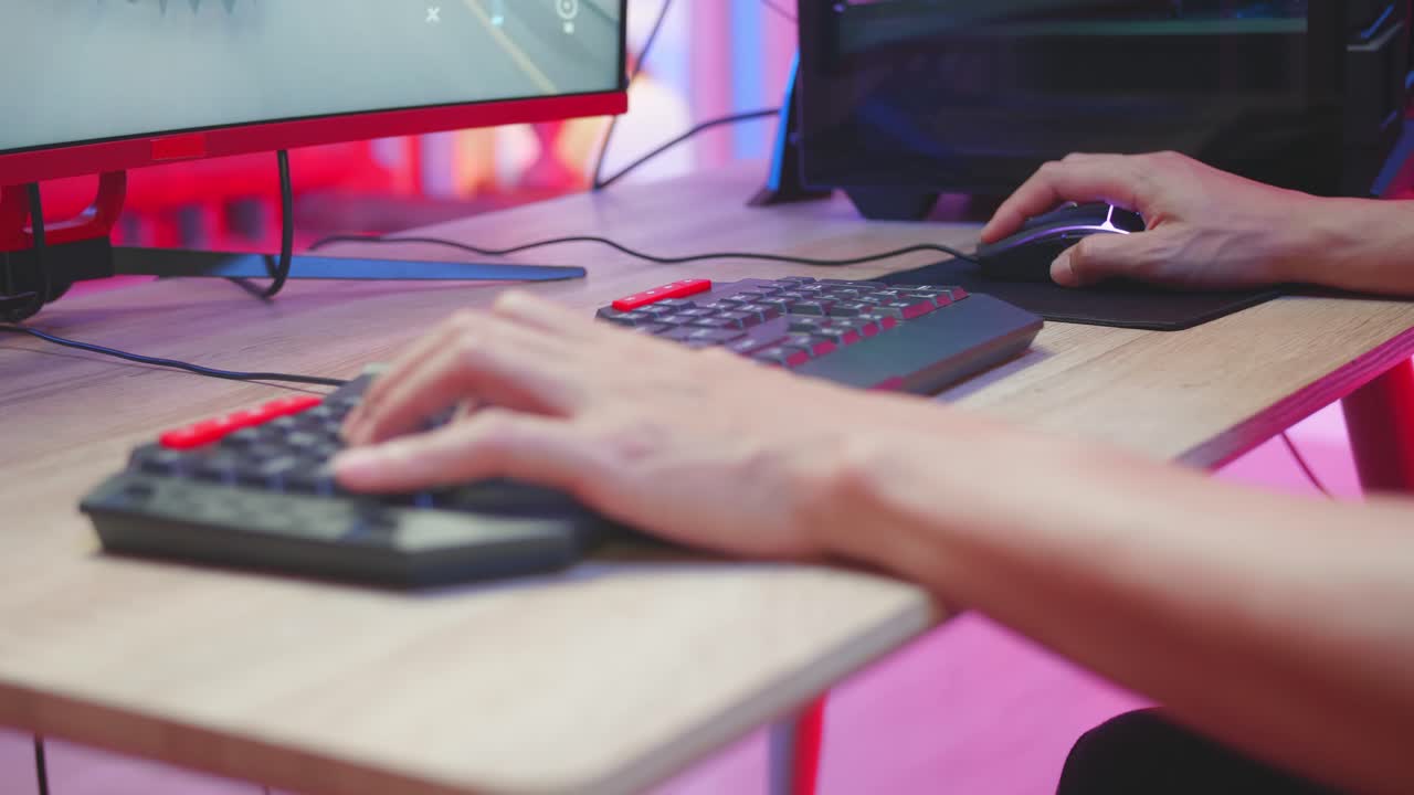 Gamer playing a video game on a computer.