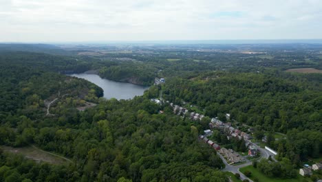 aerial drone view of wilderness with a quarry and small village