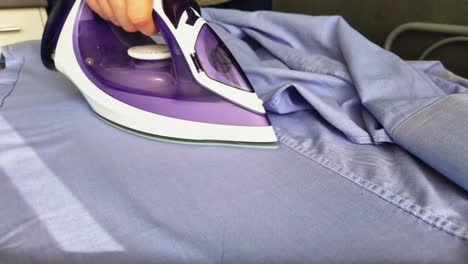 ironing clothes on an ironing board