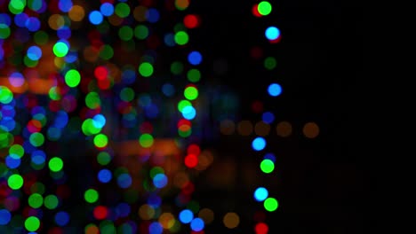 4K Bokeh unfocused footage of colorful Christmas lights at night