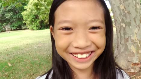 portrait of girl standing in the park