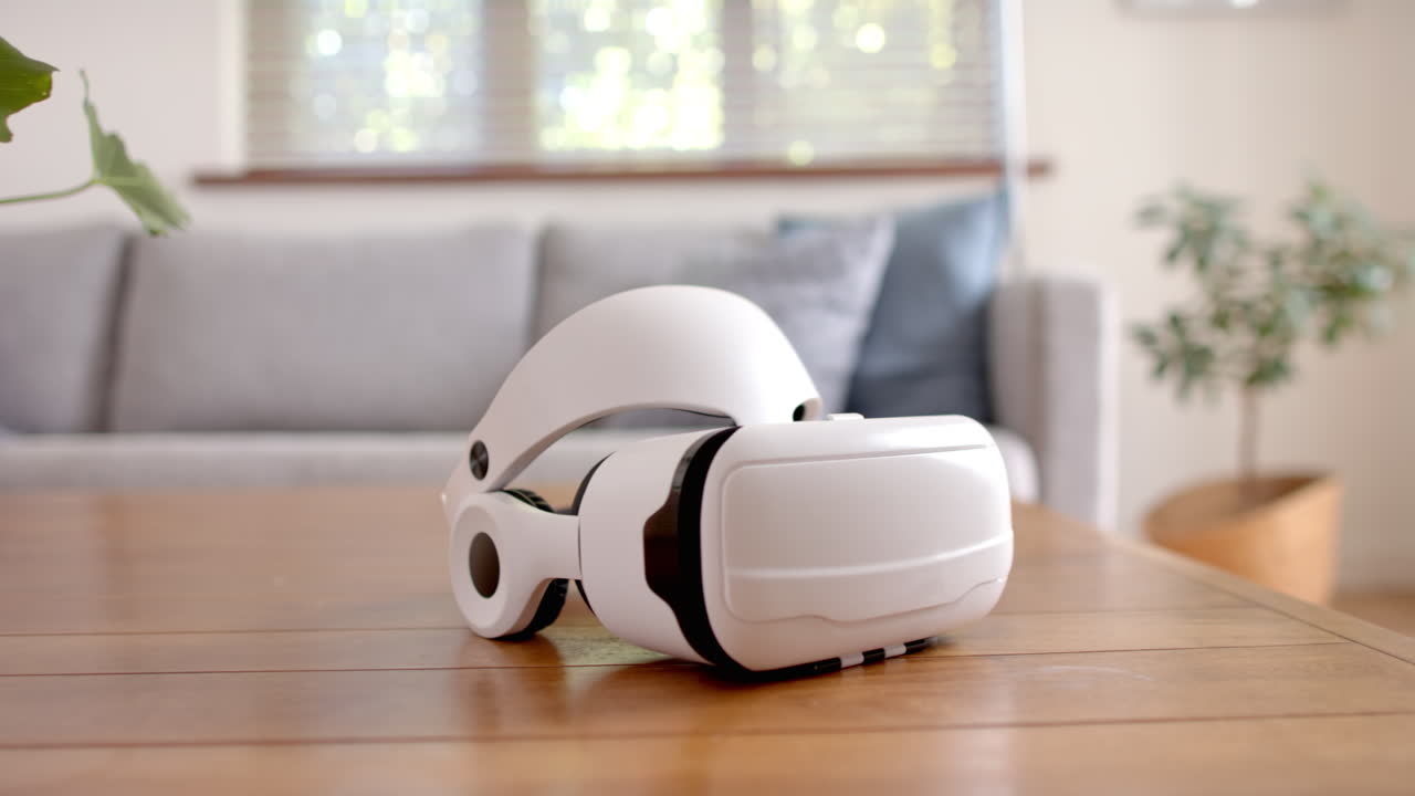 Virtual reality headset resting on wooden table in modern living room, at home, copy space