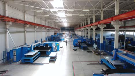 Factory Interior with Metalworking Machinery and Workers