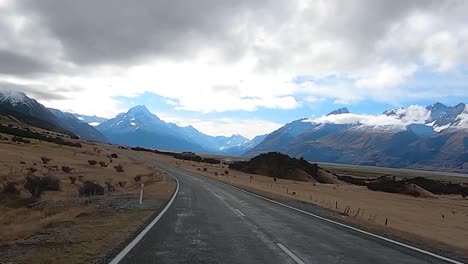 driving down mt cook national park in new zealand. during the winter period
