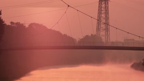 Hanging-Bridge-over-Rhine-Herne-Canal-during-Beautiful-Sunset-Landscape-in-Germany,-Static-View