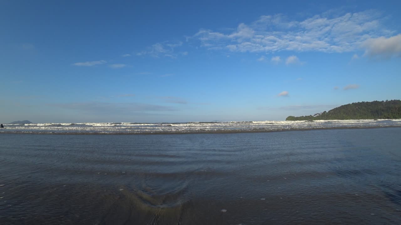 A view of the public beach at Teluk Gorek Beach, Mersing, Johor, Malaysia. A quiet afternoon with fewer visitors