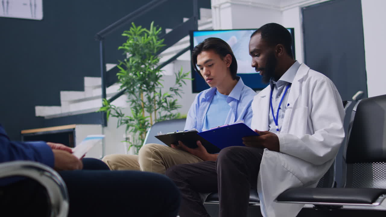 Doctor consulting with patient in a waiting room