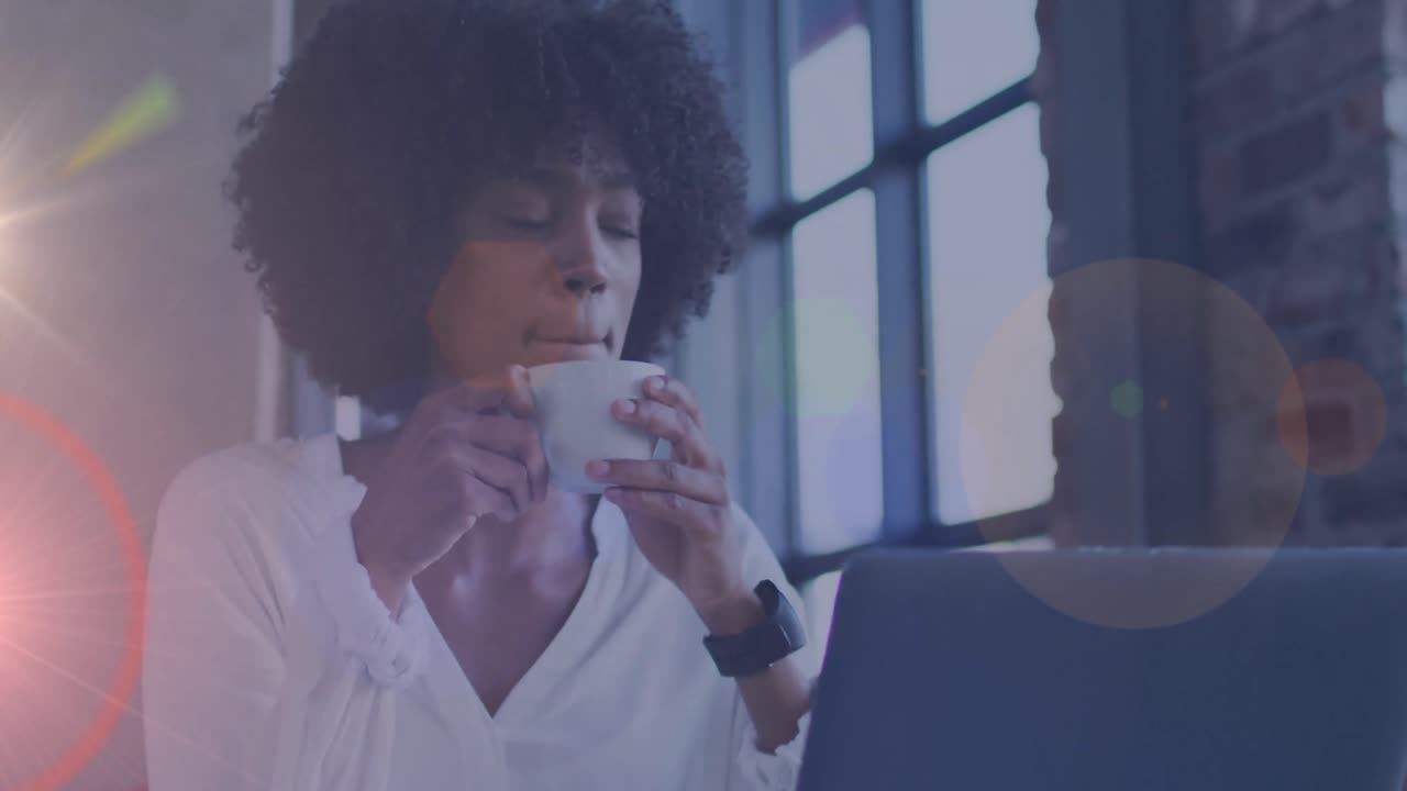 Video of lights over biracial woman sitting in restaurant