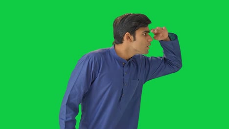 indian man searching something green screen