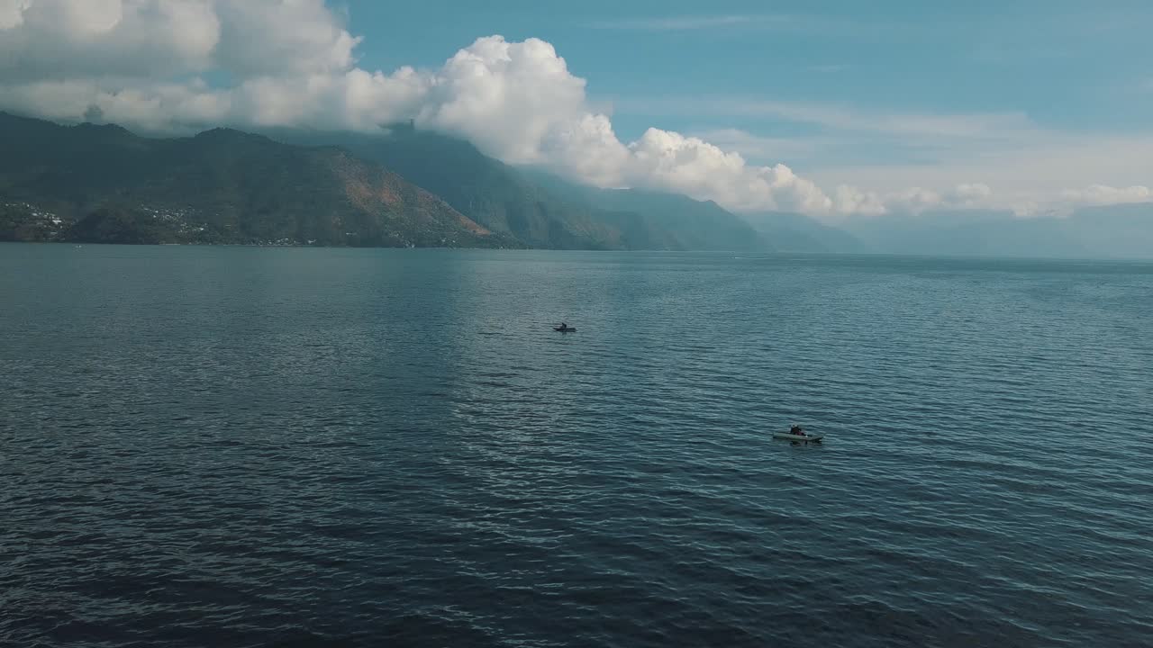 Drone aerial view of Fishing vessel in the beautiful lake Atitlan, Guatemala