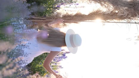 of a woman riding a swing at sunset of a woman riding a swing at sunset summer nature beautiful purple flowers outdoor recreation