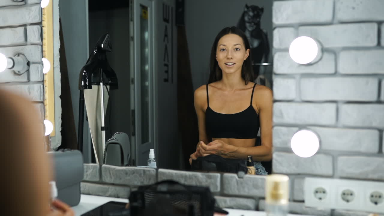 Woman getting ready for a makeup session in a studio