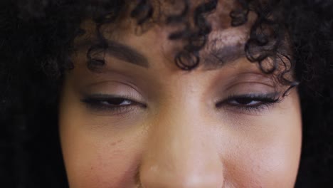 Portrait-of-african-american-businesswoman-looking-at-camera,-slow-motion