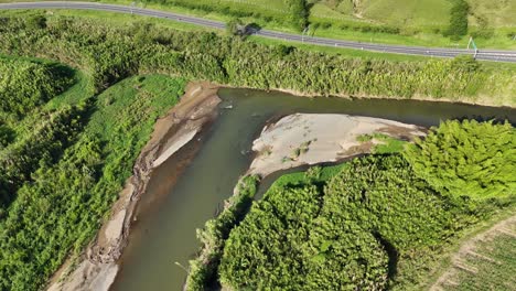 ndering river cutting through green wilderness