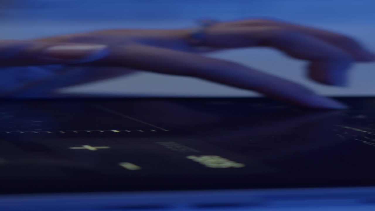 Hands of Analyst Using Financial App on Tablet PC in Neon Light