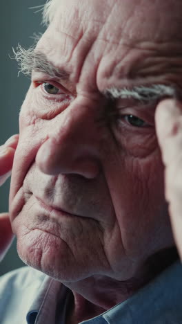 elderly man suffering from headache or pain