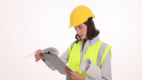 woman engineer or architect reviewing blueprints