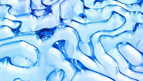 looped abstract liquid background with wavy sparkling pattern on shiny glossy surface. viscous blue fluid like surface of foil or brilliant glass. beautiful creative festive backdrop. simple bright bg