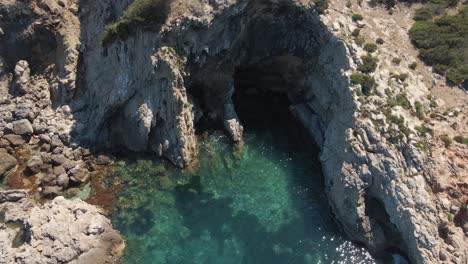 drone view of the cliffs and the beach of ibiza, spain