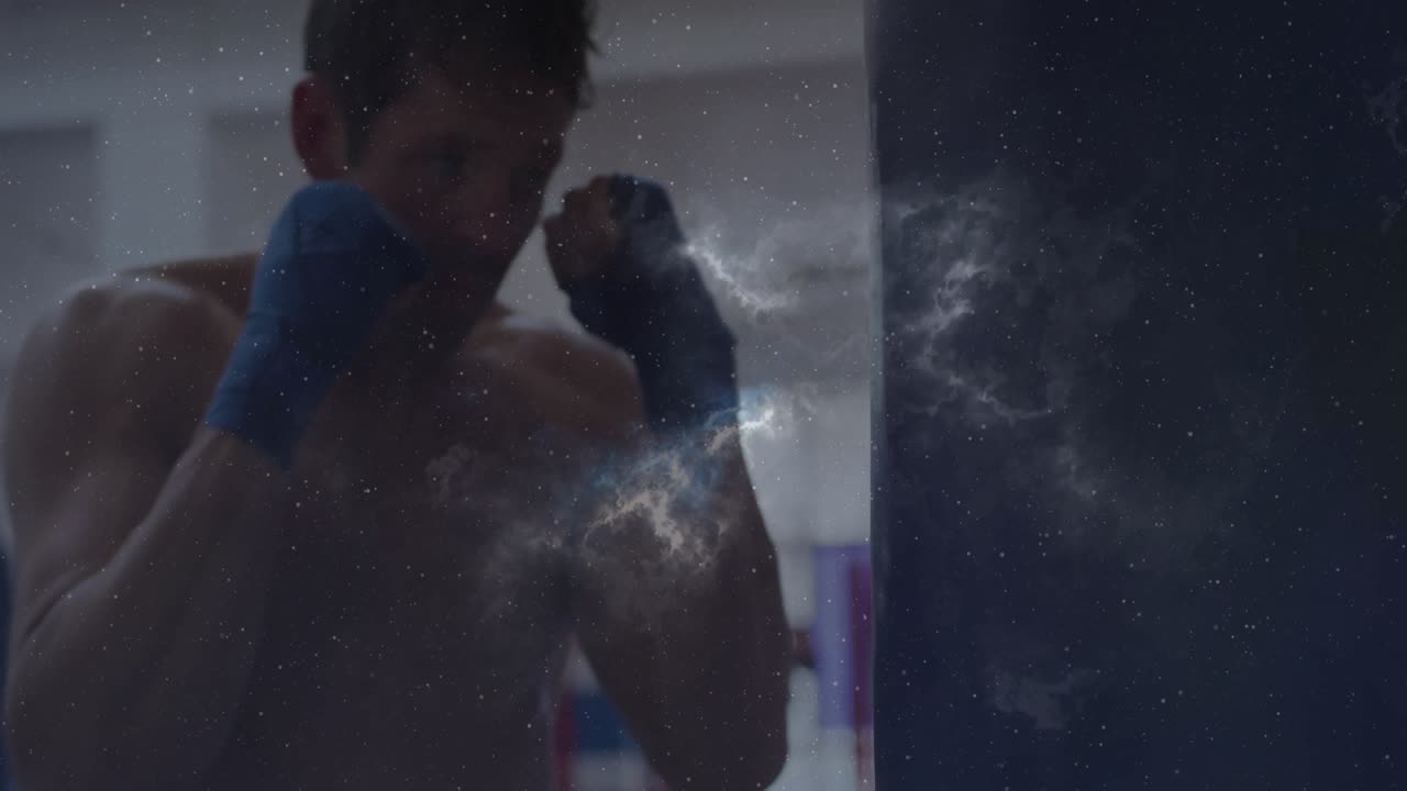 Male boxer shifting weight and throwing combos on heavy bag, training, with nebula overlay drifting