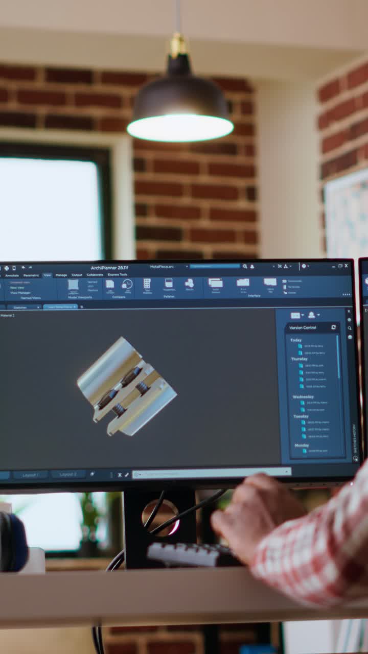 Vertical Video African american industrial designer works on prototypes in a creative studio