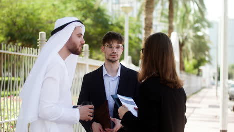 three people talking about business