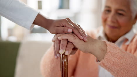 caregiver supporting elderly woman
