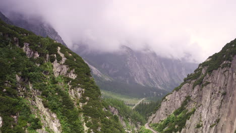 Cinematic-aerial-shot-of-a-valley-in-Guttannen,-Canton-of-Bern,-Switzerland