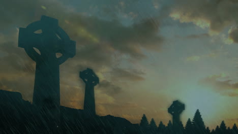 celtic crosses silhouetted against stormy sky with lightning and dark clouds