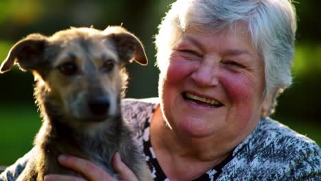 a joyful moment of companionship: an elderly woman smiling while holding her beloved dog, capturing the essence of love and friendship in a heartwarming scene