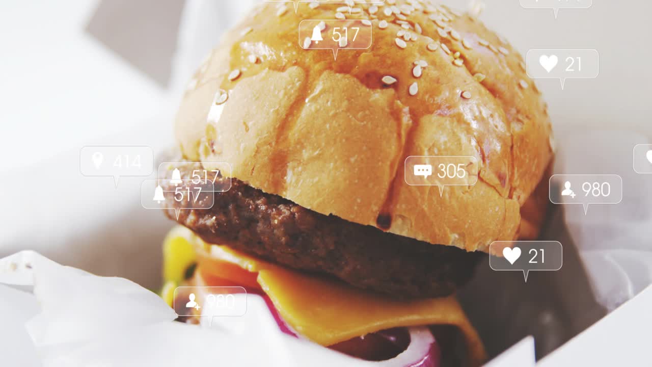 Sesame burger sitting in white box, icons appearing and floating, camera pulling back, showing buzz