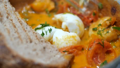 shrimp and eggs in tomato sauce with toast