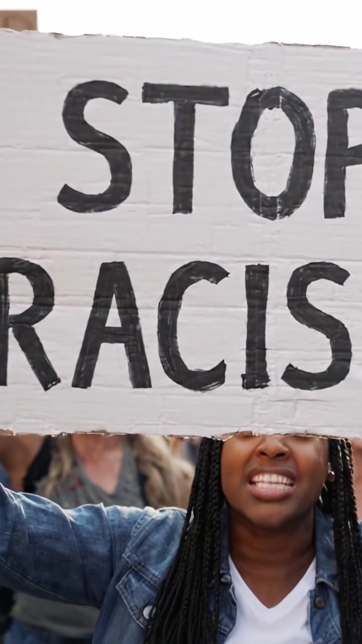 Empowered Voices Unite to Demand Action Against Racism as Protesters Rally Together, Holding Signs and Chanting for Justice and Equality in a Powerful Demonstration.