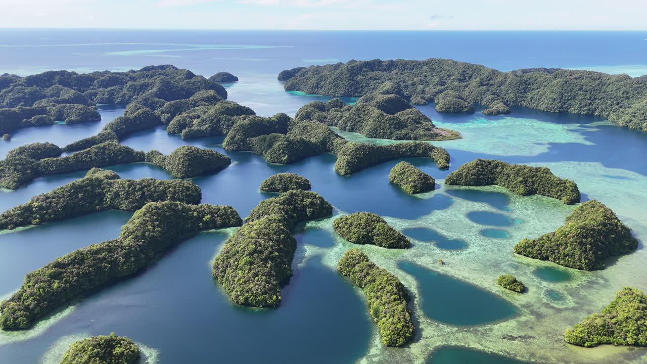 Cinematic aerial footage showcasing remote islands around Palau and tropical waters. Wide drone shot
