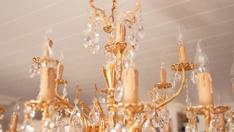 rotating and ascending close up of candelabra crystal chandelier