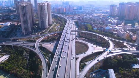 aerial photography of urban atmosphere viaduct busy multilevel interchange overpass in shanghai showing morning traffic flow coming from the elevated roads