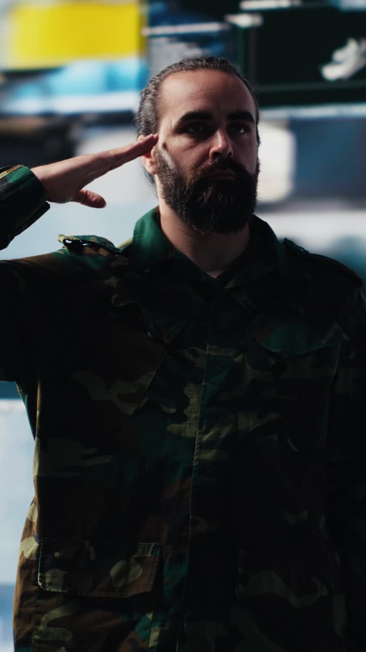 Vertical Video Male soldier showing respect and devotion with the military salute