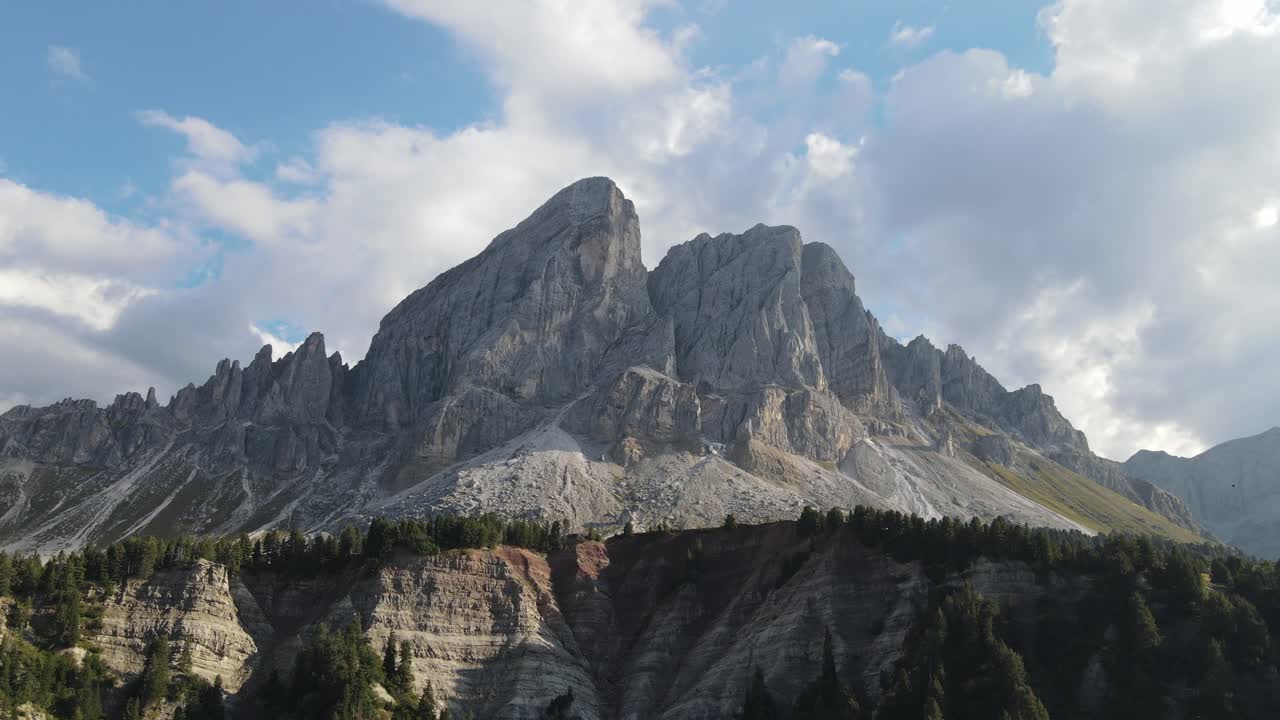 beautiful aerial drone video of the massive dolomite mountains in the Italian alps filmed in 4k in summer