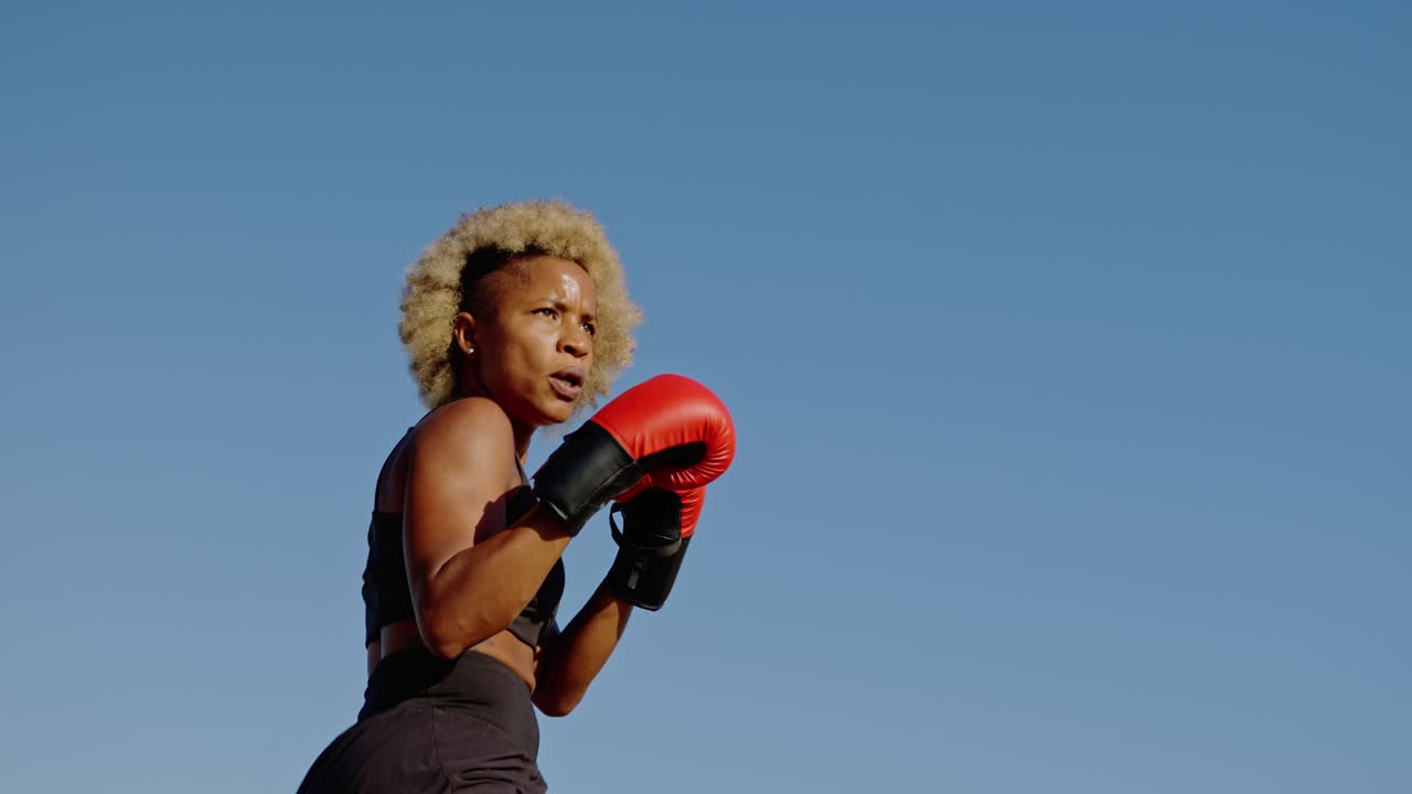 A woman boxing outdoors