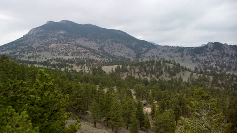 aerial view of mountain terrain over trees, estes park, eagle cliff mountain, colorado