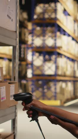 vertical video black e-commerce employee scanning awb tracking numbers