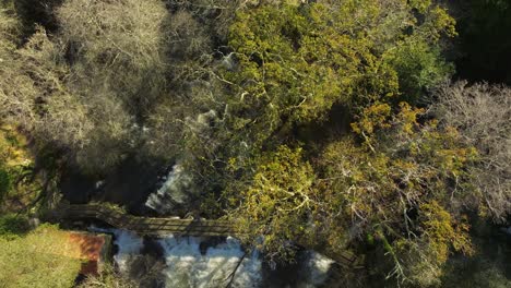 Top View Of A Bridge Over Waterfall Flowing Into The River In Zas, La Coruna, Spain