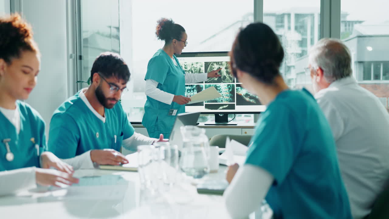 Medical team meeting to discuss x-rays and patient diagnosis