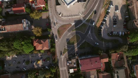 Ravenna,-Italy,-drone-top-down-rotating-view-of-roundabout-with-cars-moving