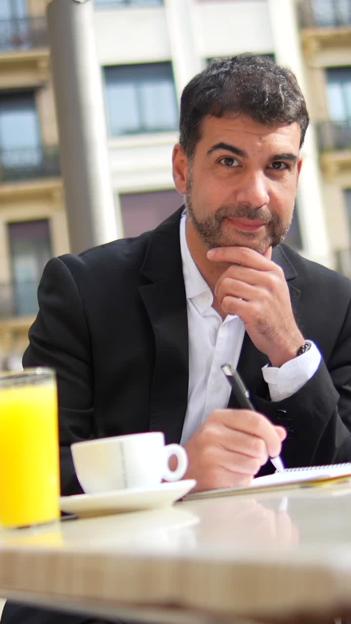 Man working at an outdoor cafe