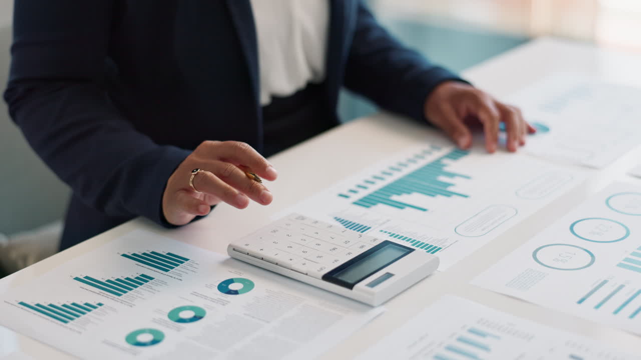 Businesswoman reviewing financial data and analysis