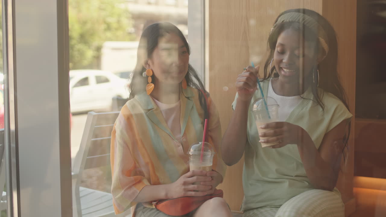 Young Women Talking in Cafe