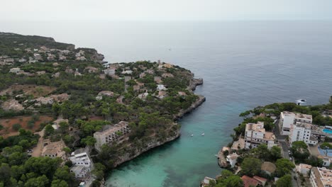 Blue-sea-and-coastal-views-looking-across-Mallorca-during-the-summer,-aerial